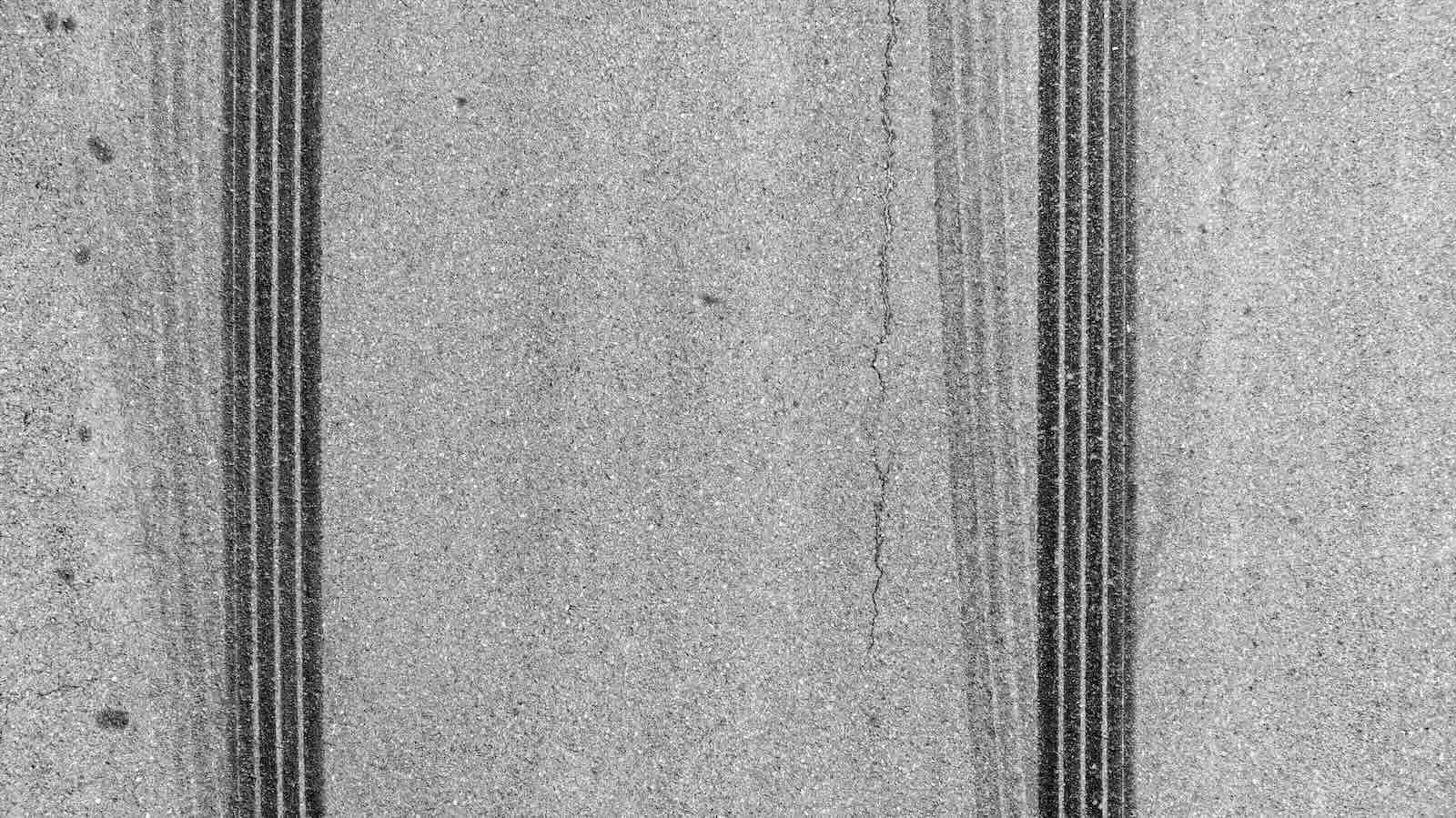 Skid marks from a GM car with its transmission recalled locking up at high speeds.