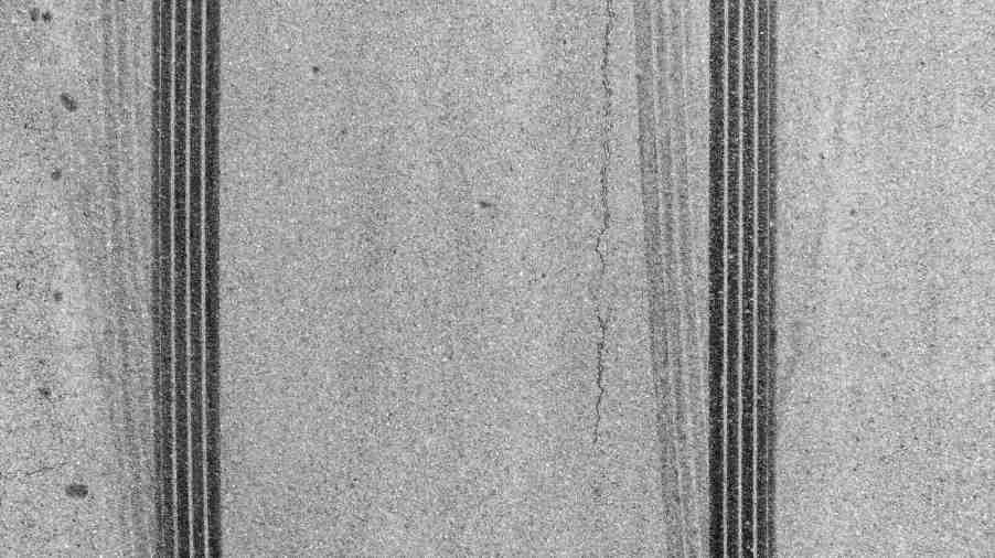 Skid marks from a GM car with its transmission recalled locking up at high speeds.