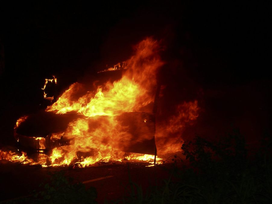 Vehicle on fire at night