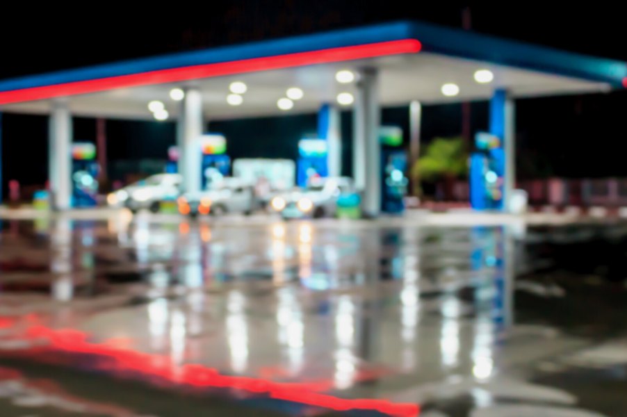 Gas station at night in blurred view