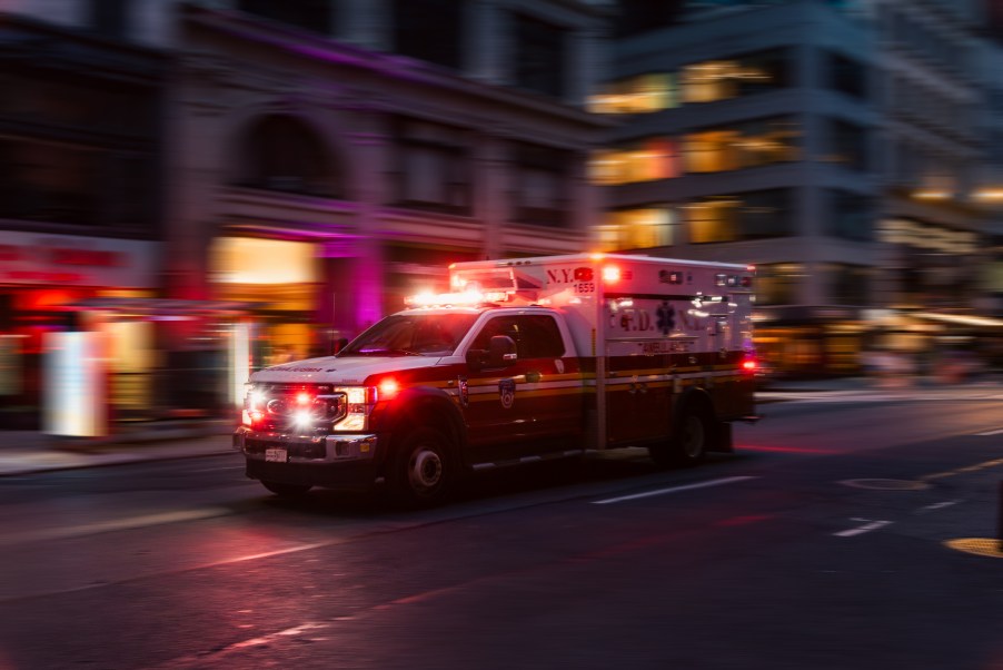 An ambulance in the city at night