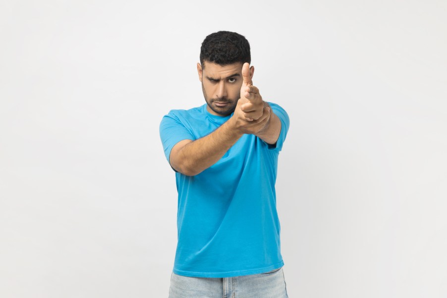 A man making a finger gun