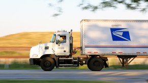 A U.S. Postal Service truck on the road