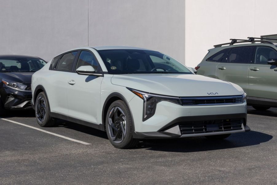 A 2025 Kia K4 parked in a dealership's lot