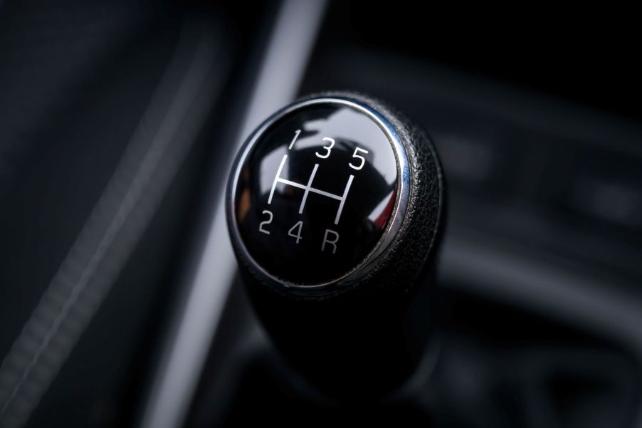 A manual transmission's gear selector, photographed from the top down