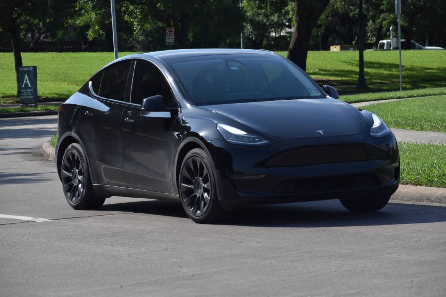 A black Tesla Model X in a parking lot