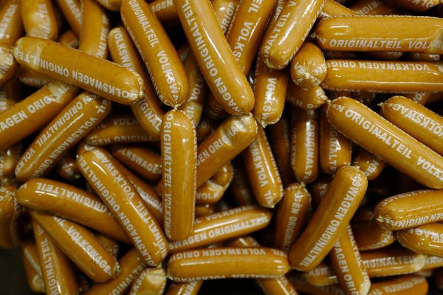 A pile of VW currywurst branded with Volkswagen markings