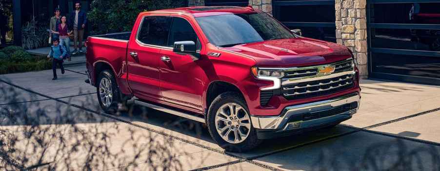 A 2024 Chevy Silverado 1500 near a home