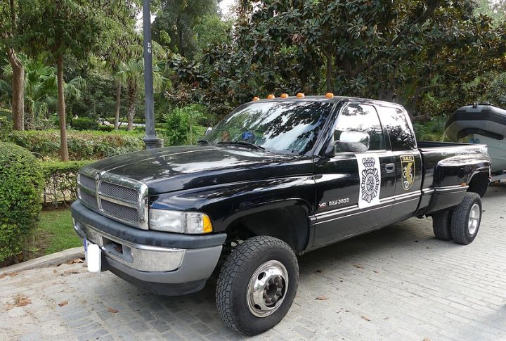 A black Dodge Ram 3500 parked in left front angle view.