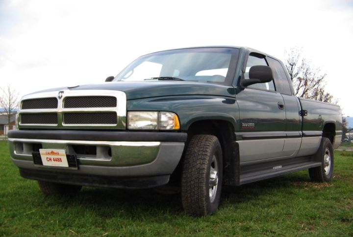 A Dodge Ram 2500 Diesel parked on grass in low left front angle view