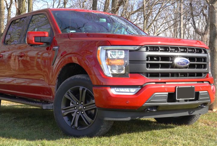 A red Ford F-150 in close right front angle view