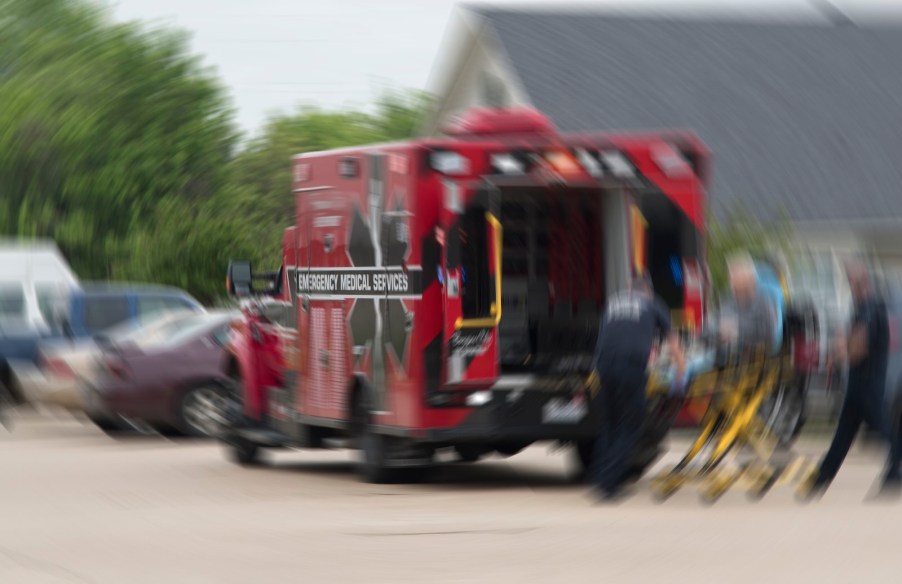 Red ambulance responds to parking lot to save Florida woman dragged by SUV