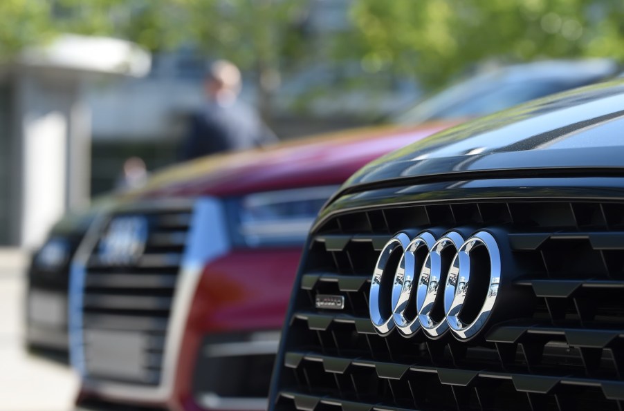 The Audi logo on the grille of cars lined up for VW recall.