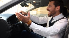 Upset Virginia driver looks out the windshield of his car.