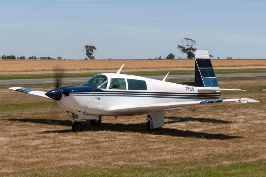 A Mooney M20, like the single-engine airplane that air traffic control stopped on the runway.