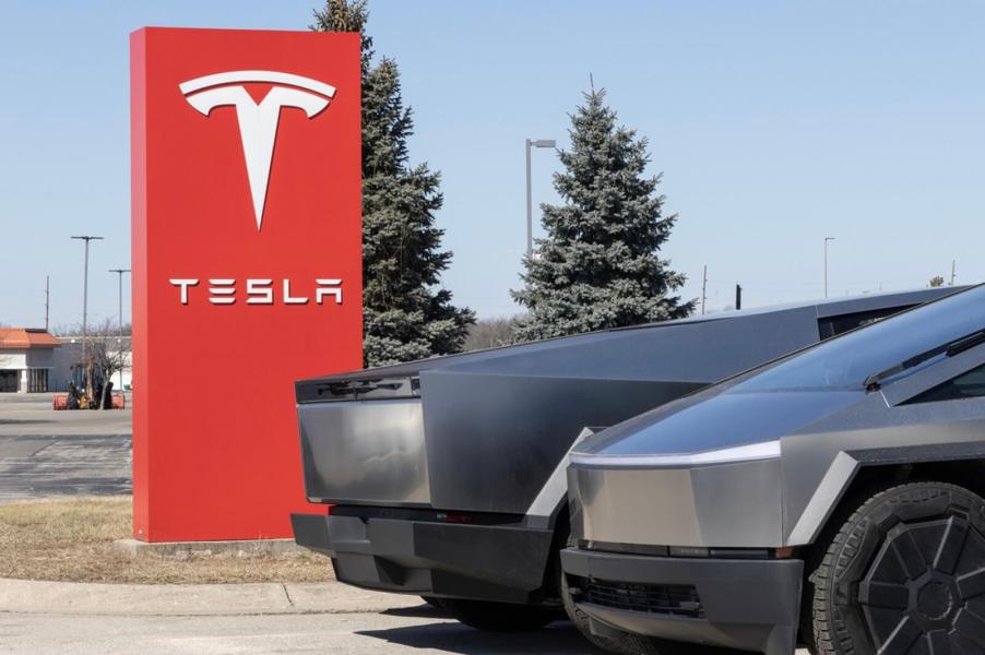 A set of Tesla Cybertruck EVs at a dealership.
