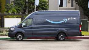 Amazon delivery van parked in full left profile view