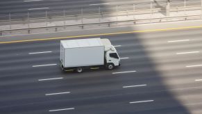 A box truck traveling down the highway