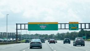 Cars driving on the highway merging into the express lane
