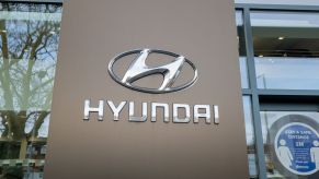 A sign reading "Hyundai" at a dealership