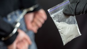 A man being arrested for cocaine