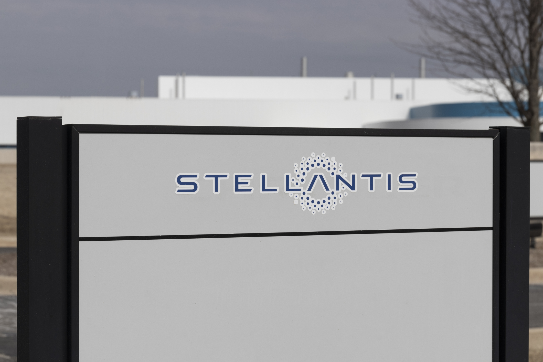 A Stellantis sign by a plant
