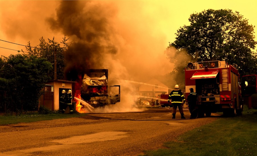 A truck and home on fire