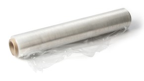 A roll of plastic cling wrap on a white background