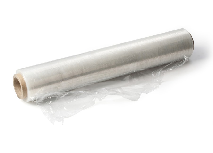 A roll of plastic cling wrap on a white background