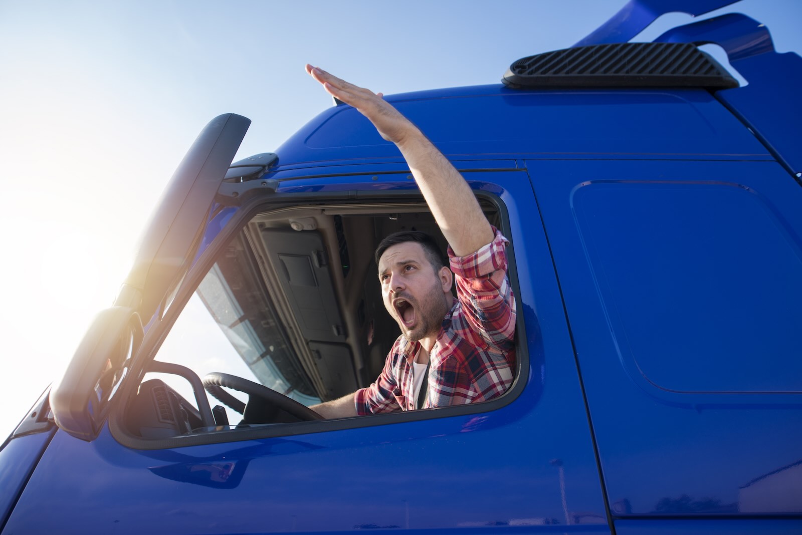 Semi trucker yelling at regular driver making mistakes he hates.