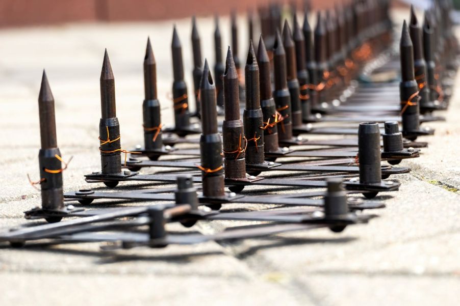 Spike strips laying on the road in an attempt to stop a speeding vehicle