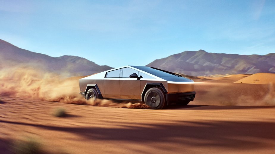 A Tesla Cybertruck kicks up sand in the desert. Until recently, Tesla wasn't accepting the Cybertruck as a trade-in.