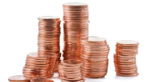 Huge stack of pennies used to pay a toll, sitting on a white background