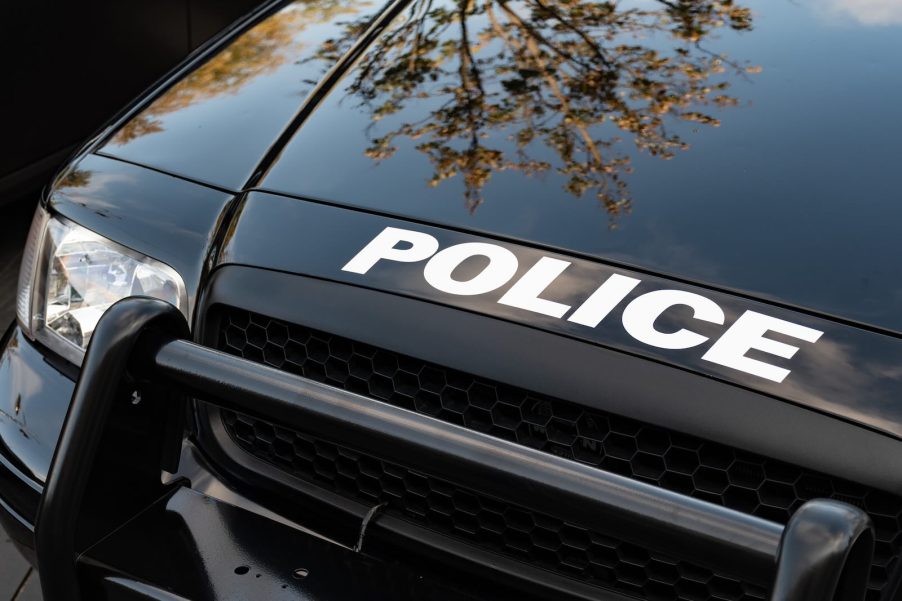 "Police" on the hood of a black car that Mason of Georgia rammed in Mississippi