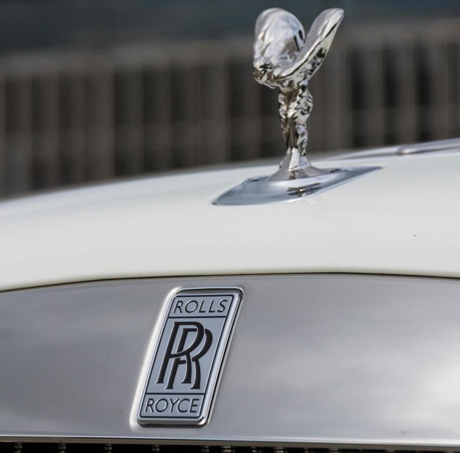 A close-up shot of a Rolls-Royce in white.