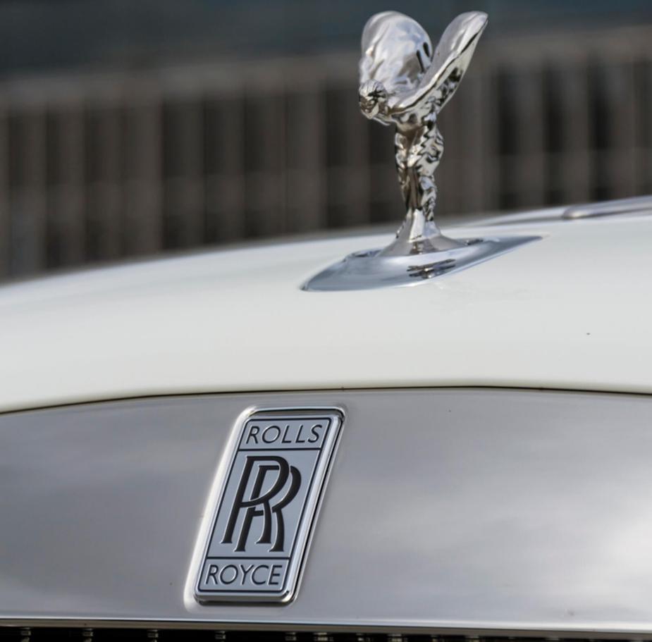 A close-up shot of a Rolls-Royce in white.