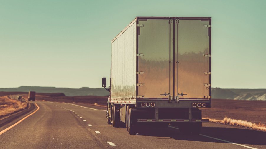 Truck driving is a complex profession and many wonder why they see semi-trucks with their hazard lights flashing while driving. Read on.