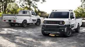 Two Toyota Hilux Champ trucks outside