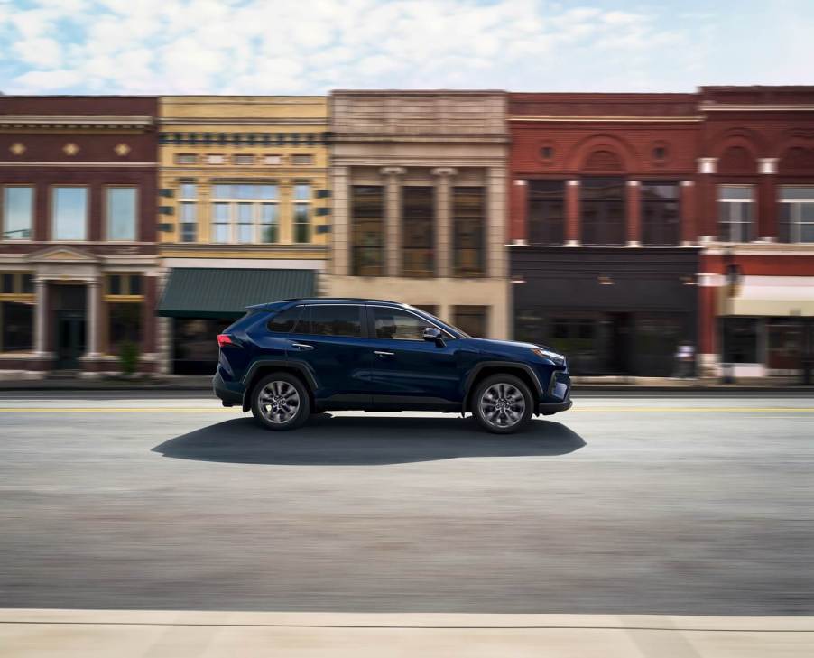 The 2025 Toyota RAV4, the best-selling vehicle in America, drives on a town street.