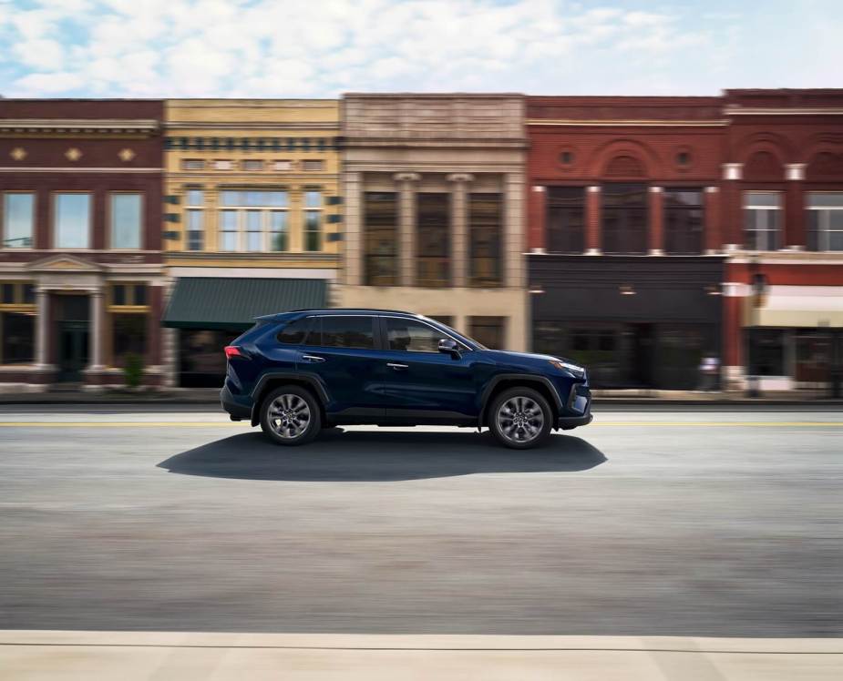 The 2025 Toyota RAV4, the best-selling vehicle in America, drives on a town street.