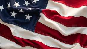 The fabric of the national flag of the USA in red white and blue.