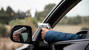 A Florida man waving a gun out the window while driving.