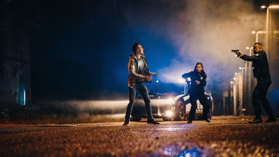 Police officers arresting a suspect