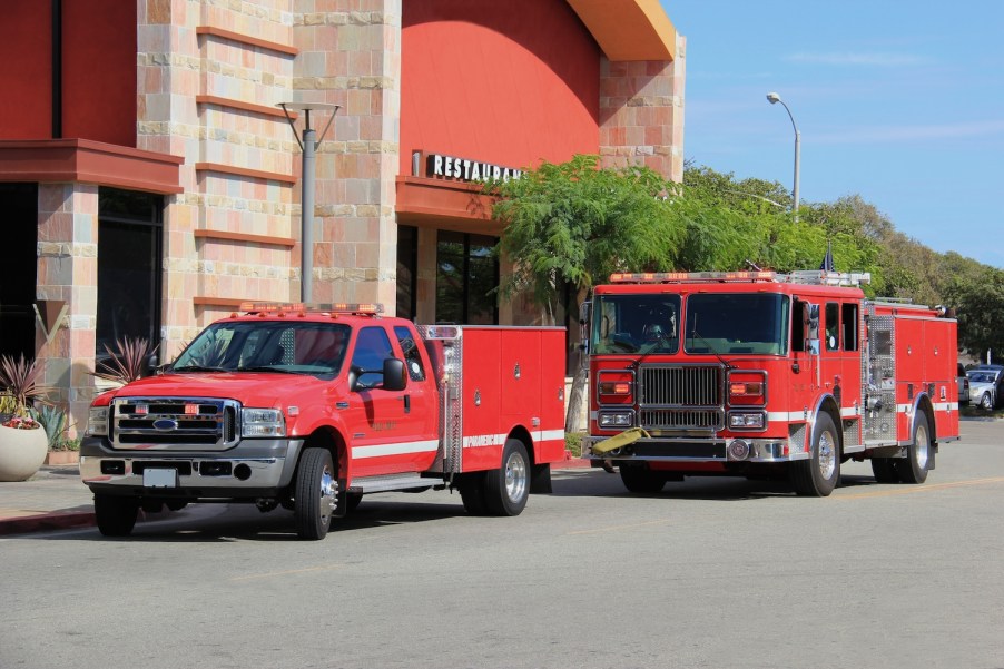 Two fire trucks near buildings