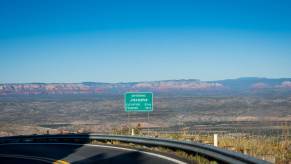 A highway sign for Jerome, Arizona posting elevation and year founded