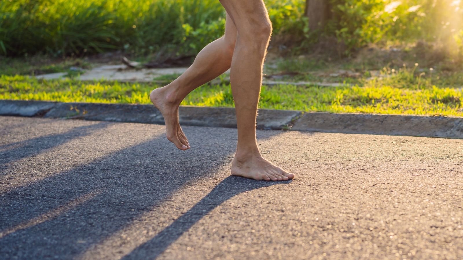 A man running barefoot, chasing a tow truck carrying his Rolls Royce