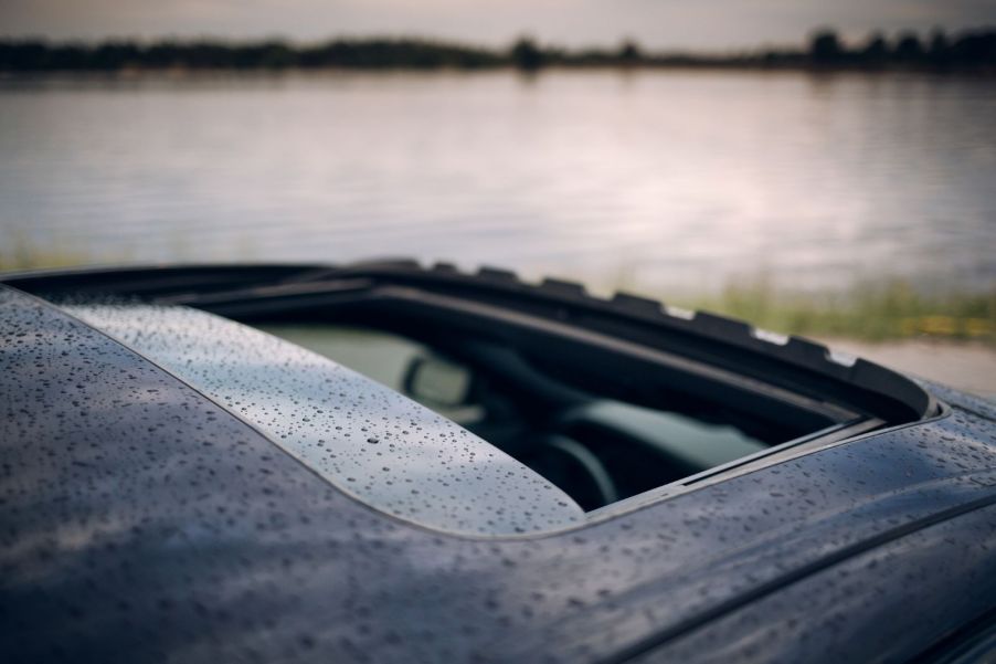 A car's roof with the sunroof open