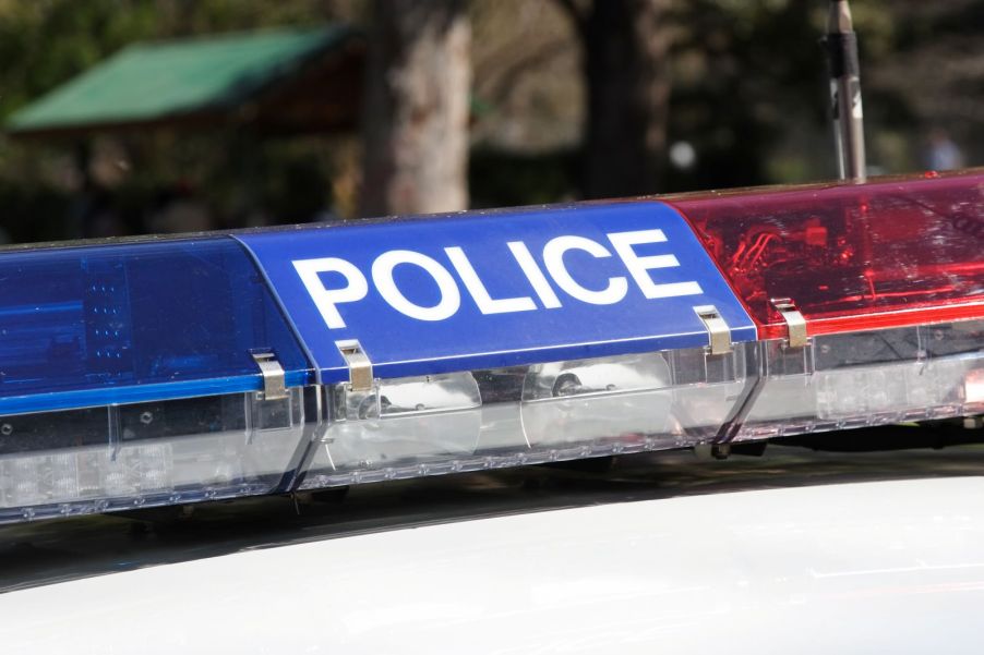 A police car's cherry lights on top of a police cruiser