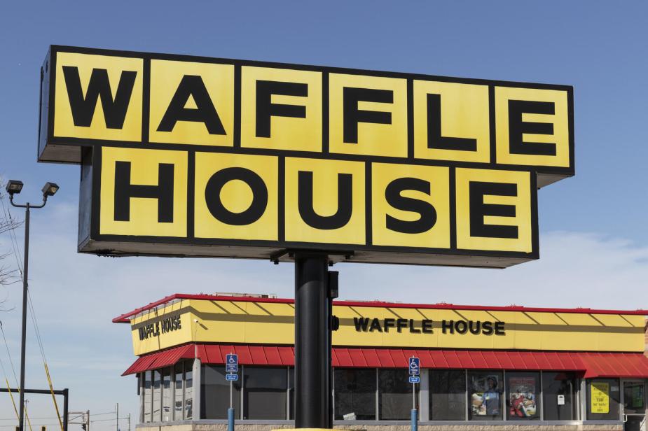 Waffle House exterior signage in close view with the restaurant building in the background