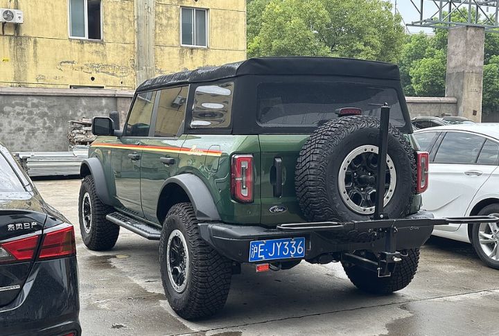 Rear-Mounted Spare Swung Away For Access